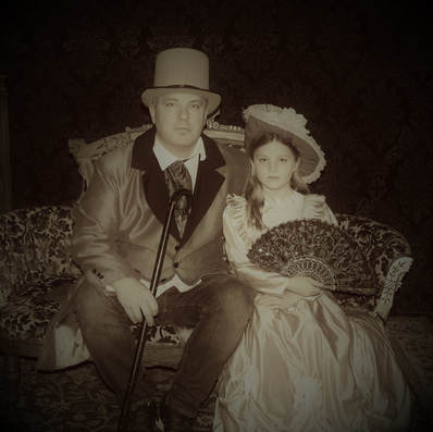 Father and daughter in Old Tyme parlor dress